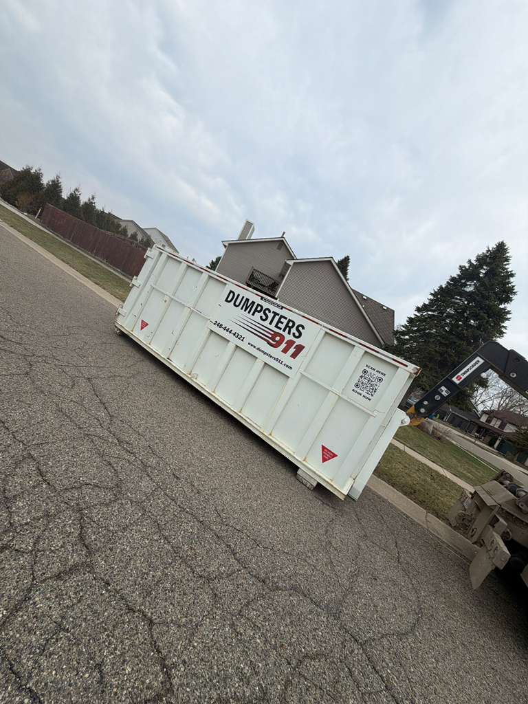 Yard Debris Dumpster Delivery Truck